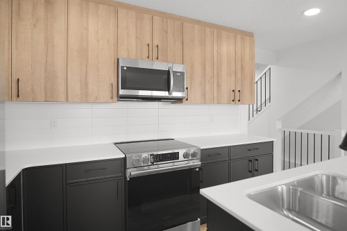 #21 1430 Aster Wy Nw, Edmonton, AB - Indoor Photo Showing Kitchen With Double Sink