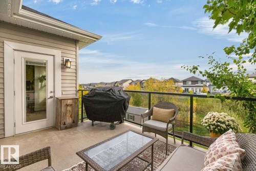 Outdoor patio with concrete flooring, glass railing, and attached exterior lighting - 21 Altadena Point(E), Sherwood Park, AB 