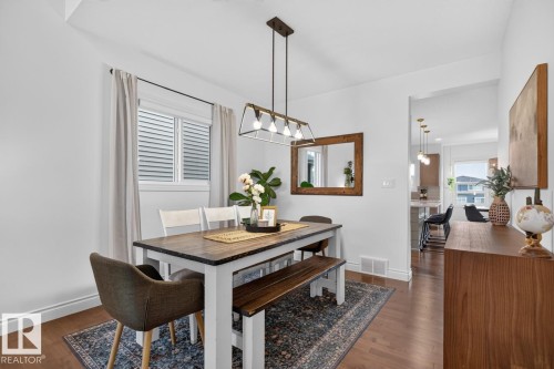 Hardwood flooring, window with blinds, recessed lighting, and a modern rectangular chandelier - 21 Altadena Point(E), Sherwood Park, AB 