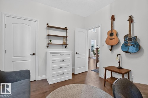 Wood-finish flooring, white walls, and white trim - 21 Altadena Point(E), Sherwood Park, AB 