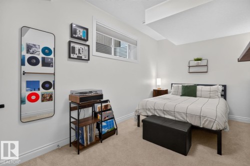 Plush carpet flooring, a high window, a wall-mounted shelf, and recessed ceiling elements - 21 Altadena Point(E), Sherwood Park, AB 