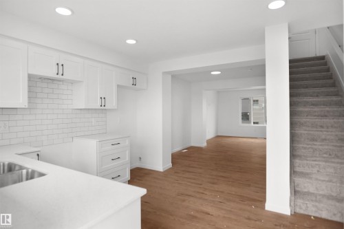 #100 3705 141 St Sw, Edmonton, AB - Indoor Photo Showing Kitchen With Double Sink