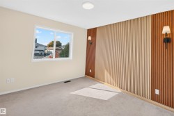 Accent wall featuring vertical wood paneling in two tones - 