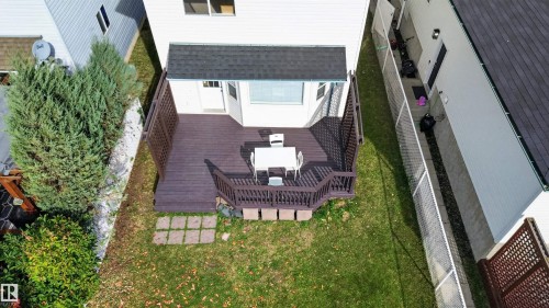 Wood-finish deck with privacy lattice and railing - 4409 150 Avenue Nw, Edmonton, AB 