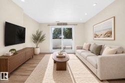 Recessed ceiling lighting, wood-finish flooring, sliding glass door, and neutral wall tones - 