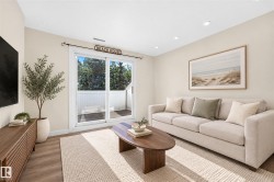 Wood-finish flooring, recessed lighting, and a built-in media console with slatted wood detailing - 