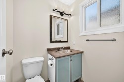 Bathroom with a single-sink vanity featuring a countertop, integrated sink, and cabinet storage - 