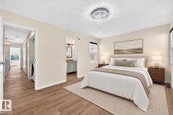 Recessed chandelier lighting, wood-finish flooring, two windows with natural light, and a dedicated laundry area - 