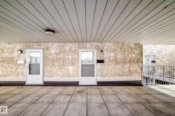 Covered entry with concrete flooring - 