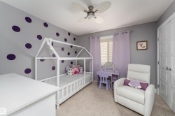 Ceiling fan with integrated lighting, wall-to-wall carpeting, light-colored walls, and window with blinds - 