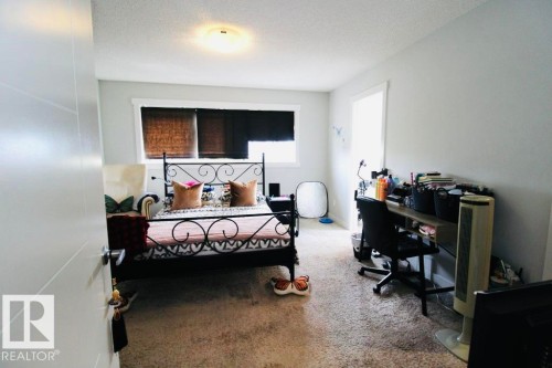 Recessed lighting, light-colored carpeting, and a window with blinds - 17440 77 Street Nw, Edmonton, AB 