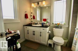 White vanity with black countertop and undermount sink - 