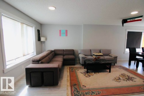 Recessed lighting, light wood-finish flooring, and white window trim - 17440 77 Street Nw, Edmonton, AB 