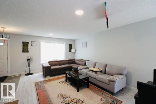 Recessed ceiling lighting, white wood-finish flooring, and a window with white trim - 17440 77 Street Nw, Edmonton, AB 