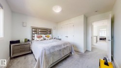 Recessed lighting, light gray carpeting, and white walls - 