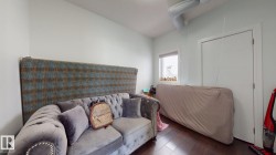 Dark wood-finish flooring with a single window - 