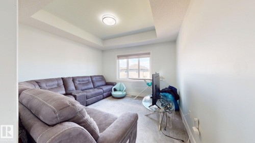 Recessed ceiling with central flush-mount lighting - 1103 30 Street Nw, Edmonton, AB 