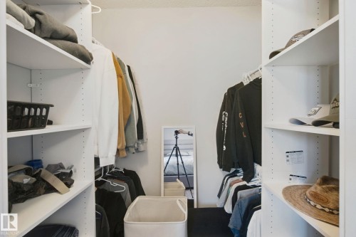 White wall-to-wall shelving with adjustable height options - 38 Menalta Place, Cardiff, AB 