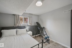 Wood-finish flooring with white trim and a neutral color palette - 