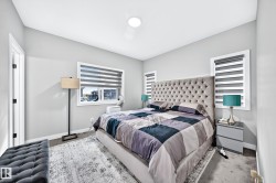 Recessed ceiling lighting, white window trim, and light gray wall paint - 