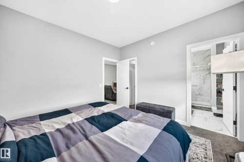 Recessed lighting, light gray wall finishes, and dark carpeting - 2415 194 Street Nw, Edmonton, AB 