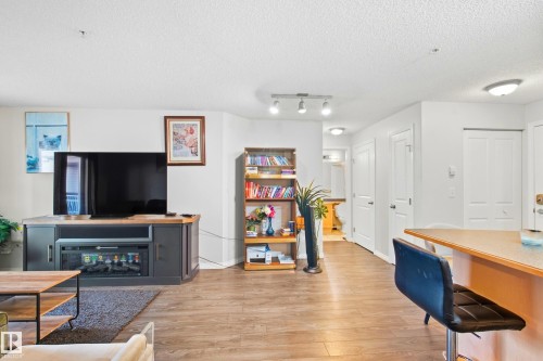 Wood-finish flooring throughout - #203 245 Edwards Dr Sw, Edmonton, AB 