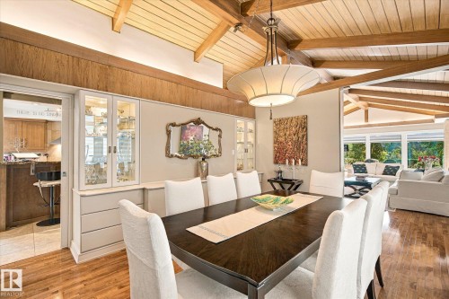 Vaulted wood-plank ceiling with exposed beams, built-in display cabinetry, wood-finish flooring, and recessed lighting - 13862 Ravine Drive Nw, Edmonton, AB 