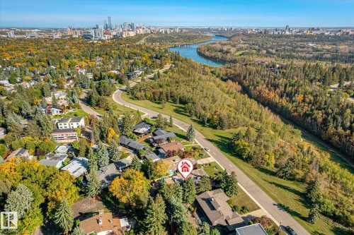 Aerial perspective showcasing an urban skyline, river, and surrounding green spaces - 13862 Ravine Drive Nw, Edmonton, AB 
