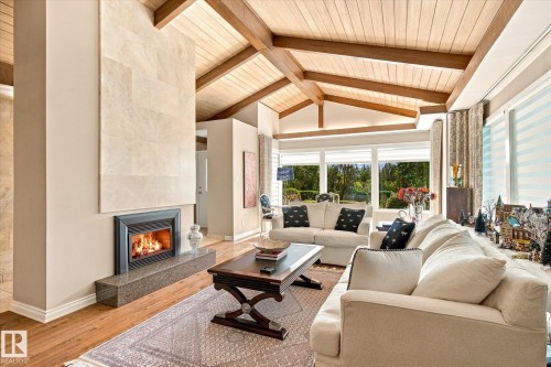 Vaulted wood-paneled ceiling with exposed beams - 13862 Ravine Drive Nw, Edmonton, AB 
