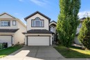 Exterior featuring a two-car garage, concrete driveway, and mature landscaping - 11515 16 Avenue Sw, Edmonton, AB 