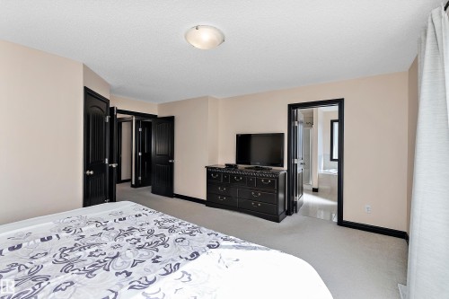 Carpeted flooring, light-toned walls, and recessed lighting - 11515 16 Avenue Sw, Edmonton, AB 
