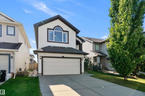 White siding exterior with dark trim accents - 11515 16 Avenue Sw, Edmonton, AB 