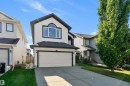 White siding exterior with dark trim accents - 11515 16 Avenue Sw, Edmonton, AB 