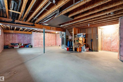 Unfinished basement featuring exposed wood joists and concrete flooring - 11515 16 Avenue Sw, Edmonton, AB 