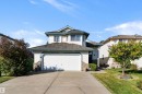 Two-story residence featuring light-toned siding and a shingled roof - 1046 Blackburn Close Sw, Edmonton, AB 