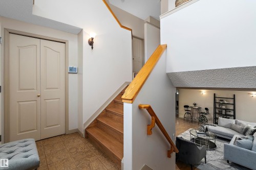 Wood-finish staircase with natural wood handrail - 1046 Blackburn Close Sw, Edmonton, AB 