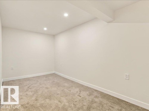 Recessed lighting, light-colored walls, and carpet flooring - 18325 66 Avenue Nw, Edmonton, AB 