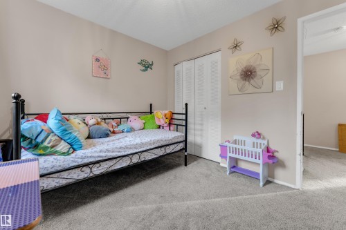 Light beige wall paint with white trim, gray carpet flooring. - 1920 145 Avenue Nw, Edmonton, AB 