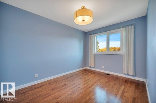 Bedroom 3. NE exposure. Hardwood floors. - 895 Lee Ridge Road Nw, Edmonton, AB 
