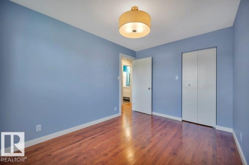 Bedroom 3. Hardwood floors. Looking toward closet and hallway. - 895 Lee Ridge Road Nw, Edmonton, AB 