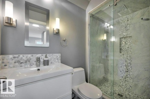 4-pc main bath with beautifully tiled walk-in shower - 895 Lee Ridge Road Nw, Edmonton, AB 