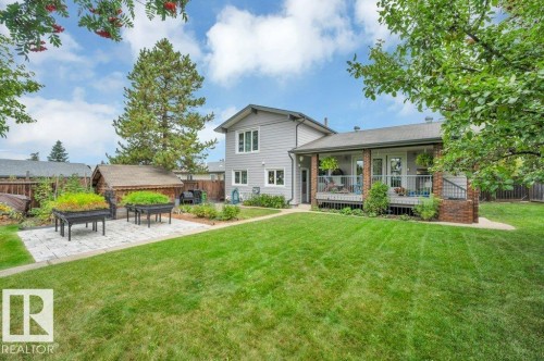 Fruit trees, berries, perennials, raised planters (included), shed (included), and round concrete patio - 895 Lee Ridge Road Nw, Edmonton, AB 