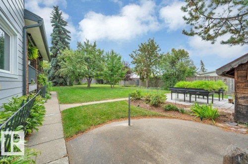 Round concrete patio and shed (included) - 895 Lee Ridge Road Nw, Edmonton, AB 