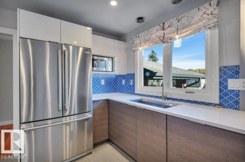 With stainless steel appliances, Kokler sink, and Grohe faucet - 895 Lee Ridge Road Nw, Edmonton, AB 