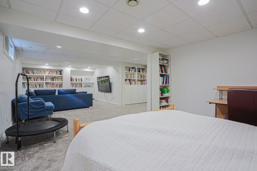 Recessed lighting, built-in shelving, low-pile carpeting, and a drop ceiling - 995 Ogilvie Boulevard Nw, Edmonton, AB 