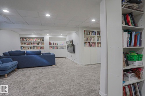 Recessed lighting, built-in shelving, white painted walls, and gray carpet flooring - 995 Ogilvie Boulevard Nw, Edmonton, AB 