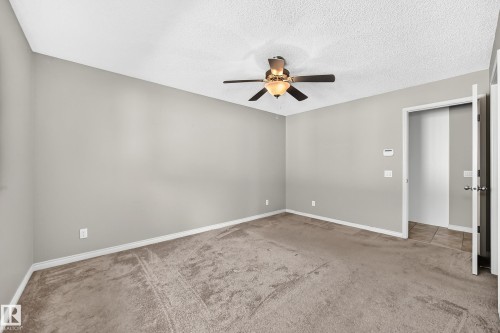 Neutral-toned walls complement the textured ceiling - 21 Silverstone Drive, Stony Plain, AB 