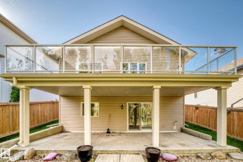 Second-story deck with glass panel railing - 21 Silverstone Drive, Stony Plain, AB 