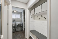 Laundry area with a window and tiled flooring - 
