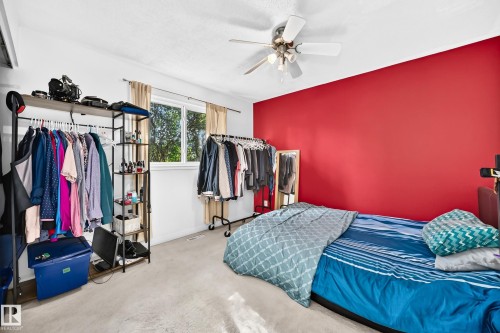 White textured ceiling with a central ceiling fan - 11007 173A Avenue Nw, Edmonton, AB 